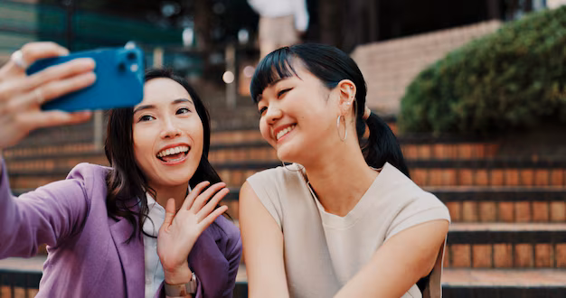 women-video-call-friends-with-wave-city-stairs-contact-with-smile-outdoor-chat-web-people-together-smartphone-with-social-network-hello-mobile-app-steps-japan_590464-518838